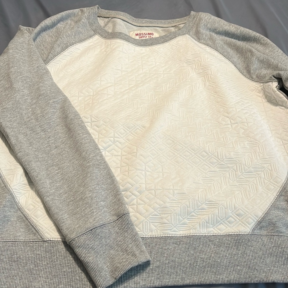Gray and cream colored quilted sweatshirt